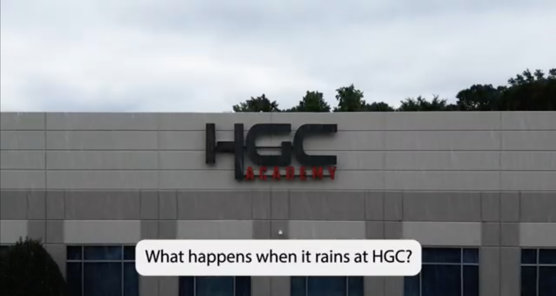 the HGC academy logo on a building