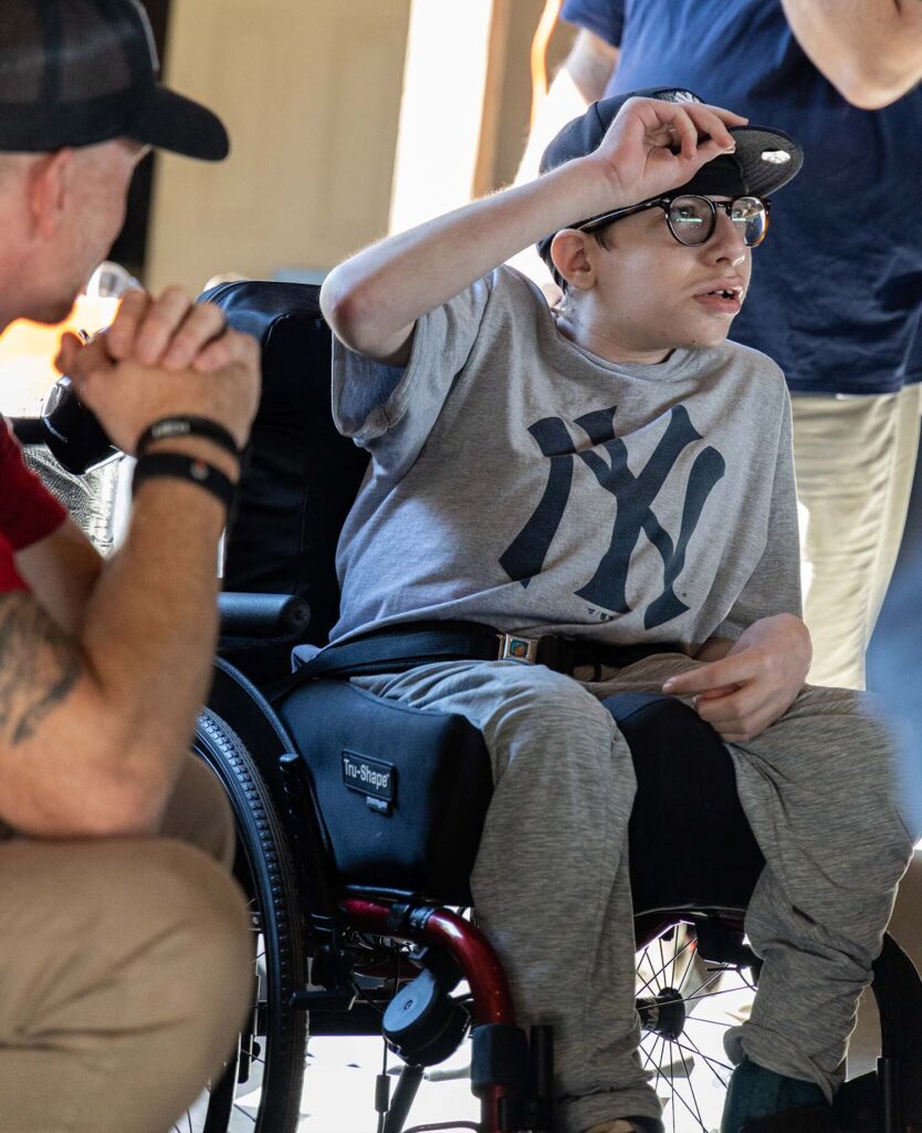 Dream kid alumni recounting his personal story at HGC's clay shoot