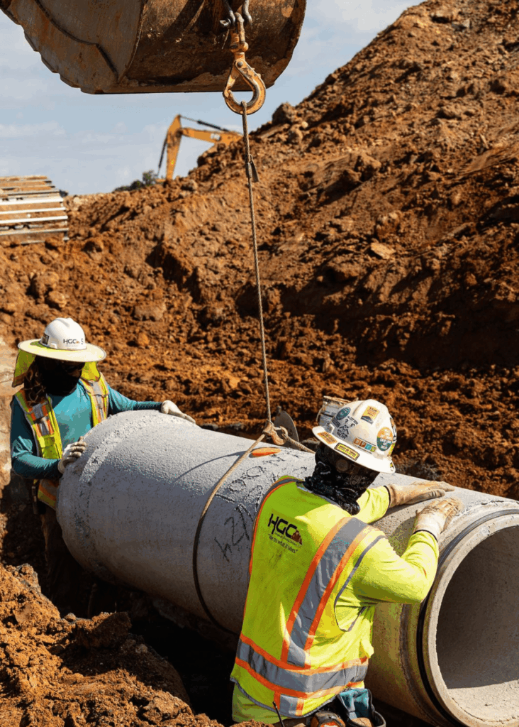 Utilities pipe crew working on utility installation at a job site