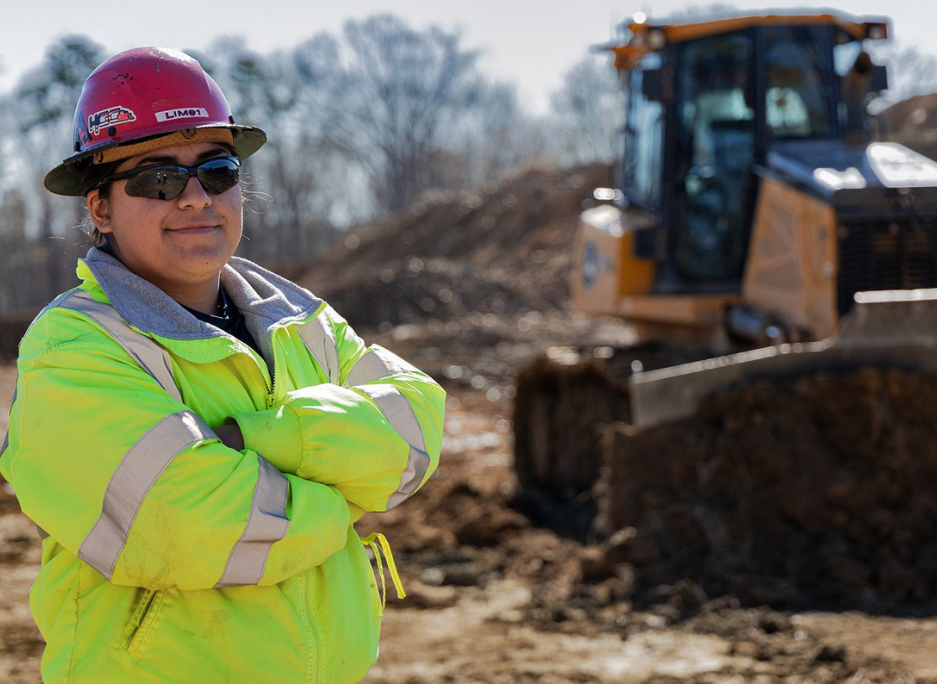 Hoopaugh Grading teammate portrait in front of Carolina Cat Dozer.