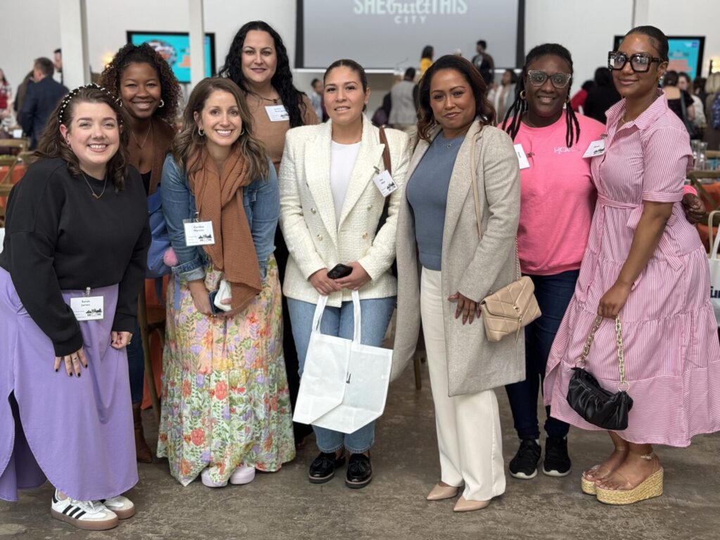 women at a luncheon posing together