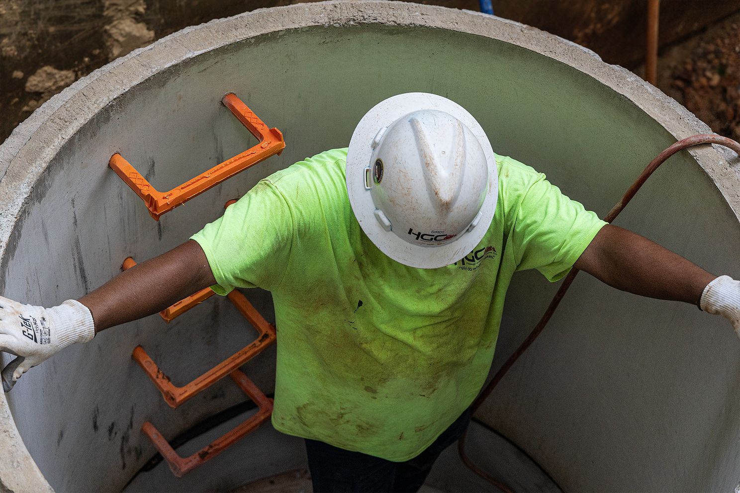 HGC Utilities Teammate Coming from Large Pipe